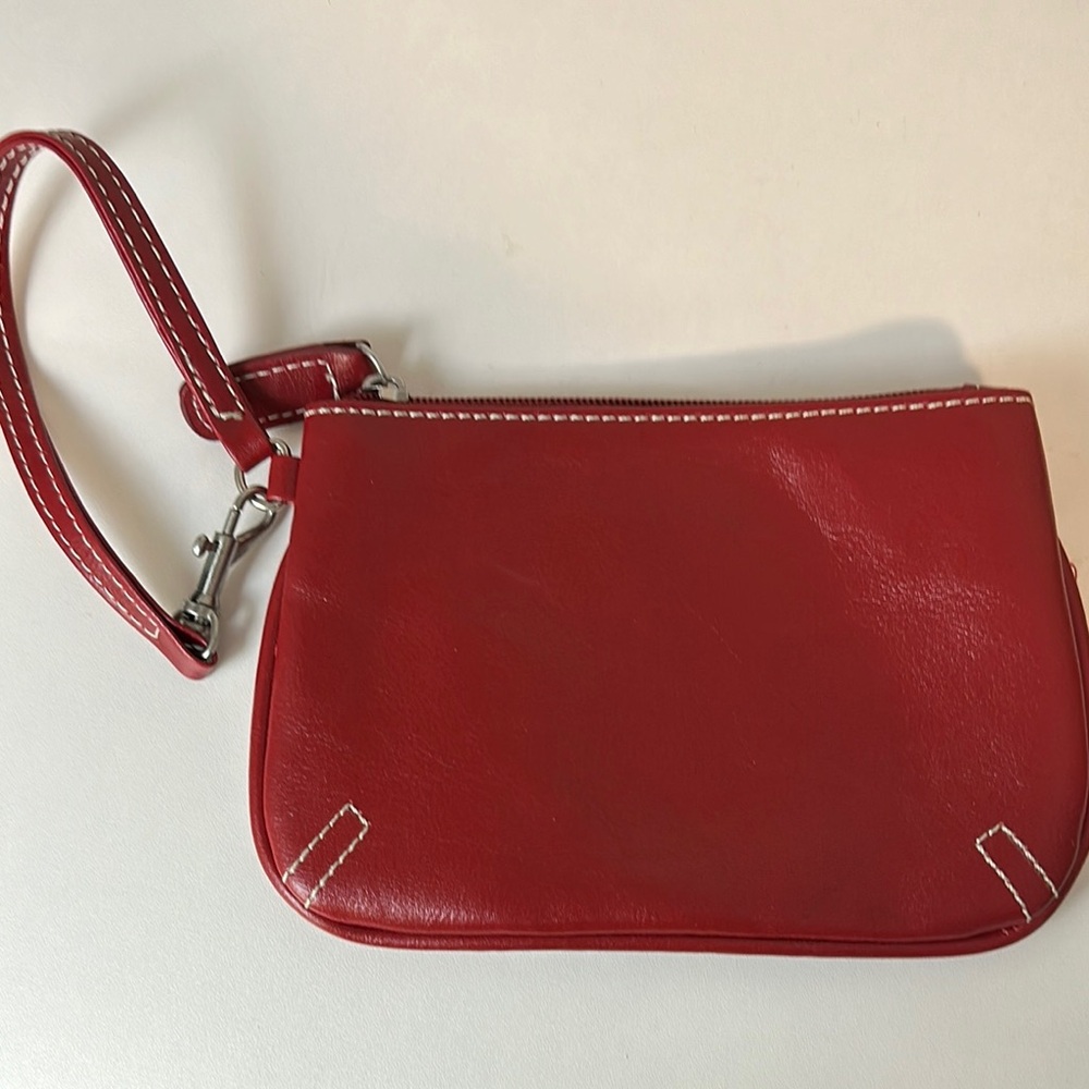 Mini Red Leather Wristlet with contrasting white stitching.